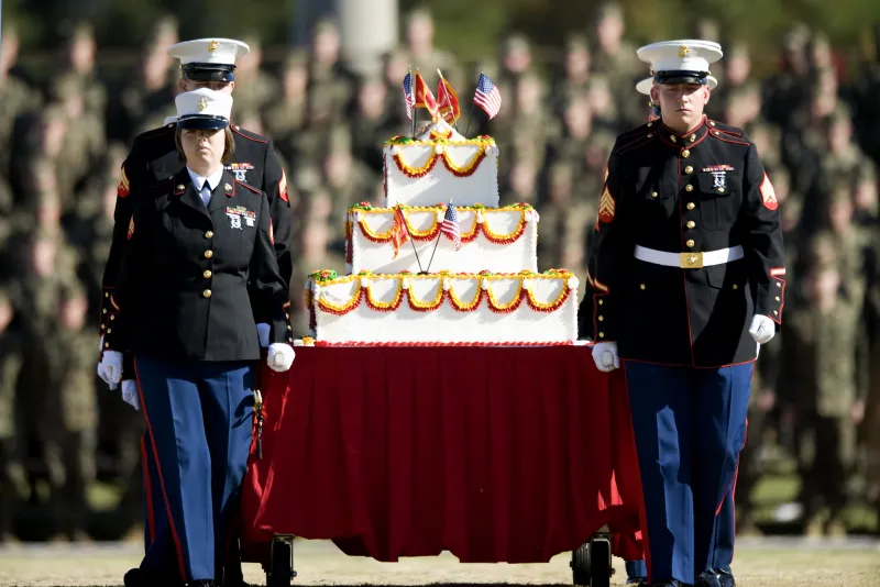 Marines carrying a cake